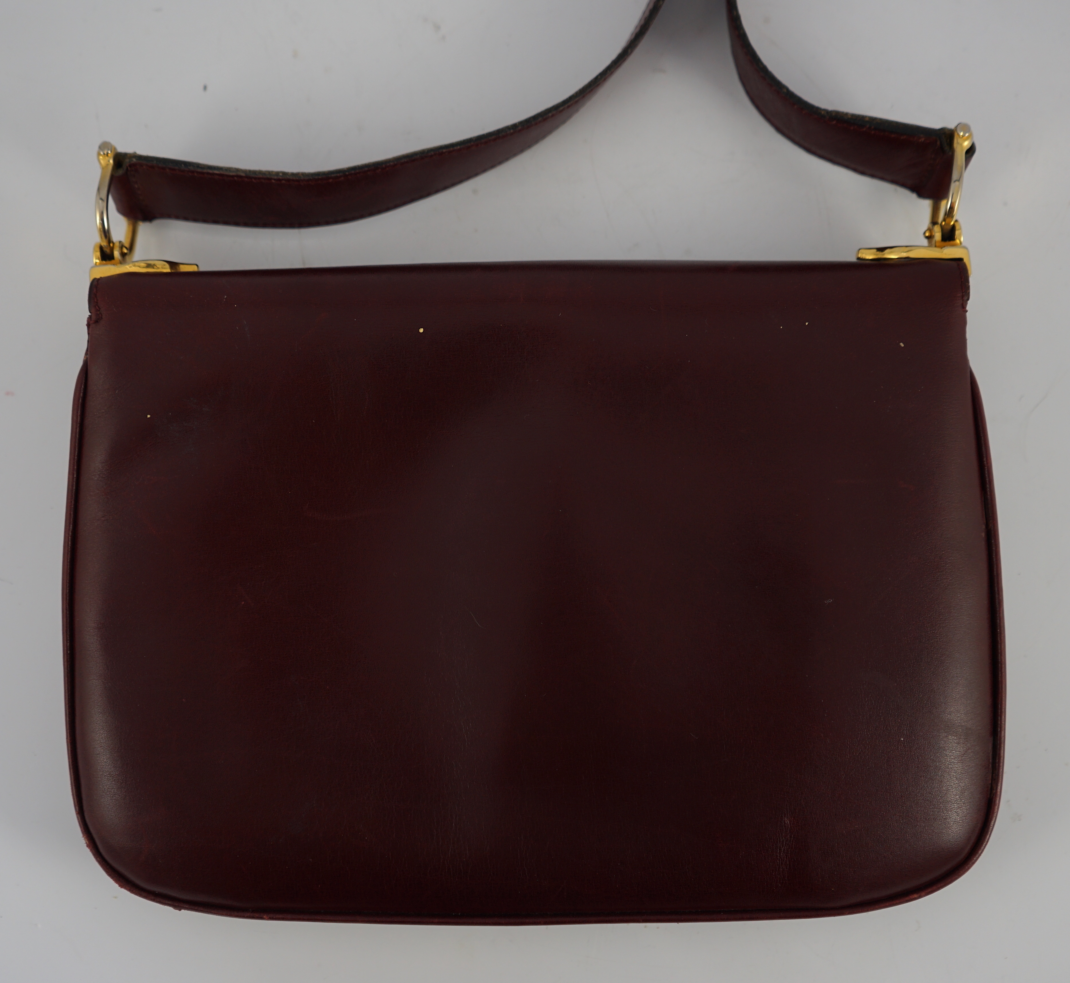 A vintage Celine horse carriage cargo flap burgundy leather shoulder bag, width 26cm, depth 3cm, height 18.5cm